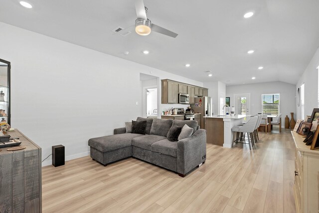 1242 Amistad Loop, College Station, TX 77845 - living area with light wood-style flooring, ceiling fan, recessed lighting, baseboards, and lofted ceiling