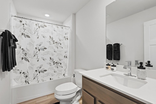 1242 Amistad Loop, College Station, TX 77845 - bathroom featuring toilet, vanity, shower / tub combo with curtain, and wood finished floors