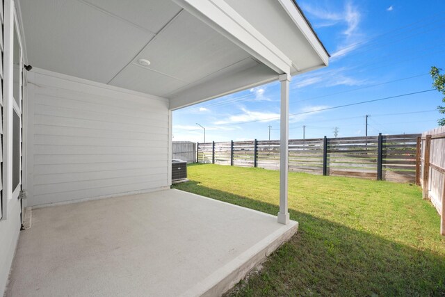 1242 Amistad Loop, College Station, TX 77845 - view of yard featuring a patio and central AC