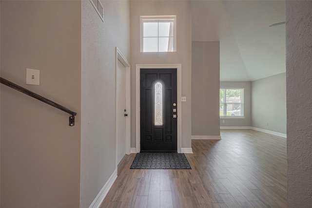 8547 Sparkling Springs Dr, Houston, TX 77095 - foyer entrance with wood finished floors, a high ceiling, and baseboards