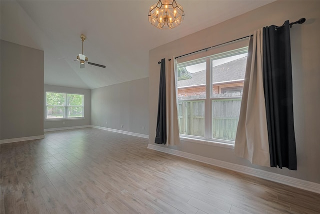 8547 Sparkling Springs Dr, Houston, TX 77095 - unfurnished room with a chandelier, baseboards, ceiling fan, wood finished floors, and vaulted ceiling