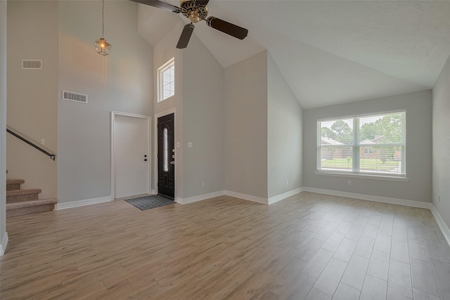8547 Sparkling Springs Dr, Houston, TX 77095 - foyer entrance featuring plenty of natural light, ceiling fan, light wood-style floors, and high vaulted ceiling