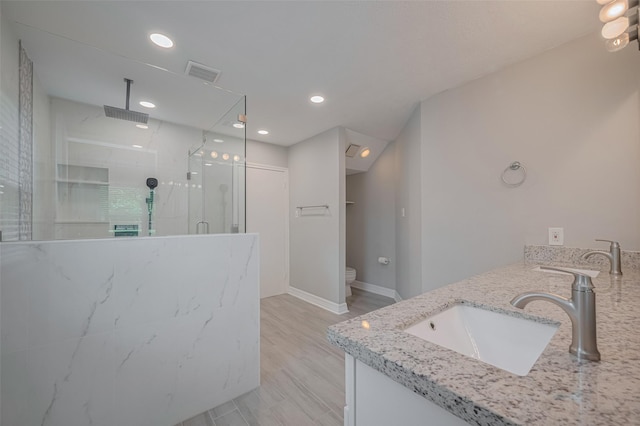 8547 Sparkling Springs Dr, Houston, TX 77095 - bathroom with a shower stall, toilet, recessed lighting, baseboards, and double vanity