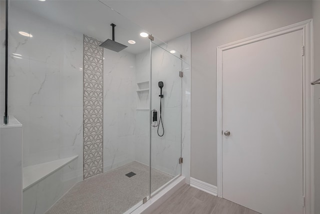 8547 Sparkling Springs Dr, Houston, TX 77095 - full bathroom featuring a marble finish shower, recessed lighting, and wood finished floors