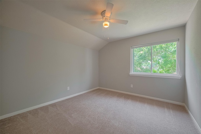 8547 Sparkling Springs Dr, Houston, TX 77095 - additional living space with light carpet, baseboards, a ceiling fan, and vaulted ceiling