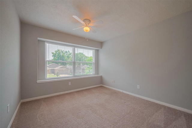 8547 Sparkling Springs Dr, Houston, TX 77095 - unfurnished room featuring carpet floors, ceiling fan, a textured ceiling, and baseboards
