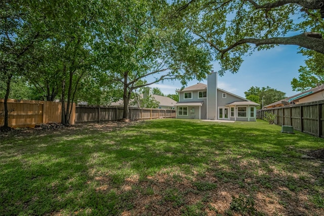 8547 Sparkling Springs Dr, Houston, TX 77095 - view of yard featuring french doors and central AC unit
