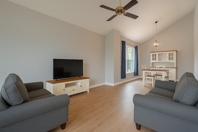 8547 Sparkling Springs Dr, Houston, TX 77095 - living room featuring high vaulted ceiling, a ceiling fan, light wood-style flooring, and baseboards