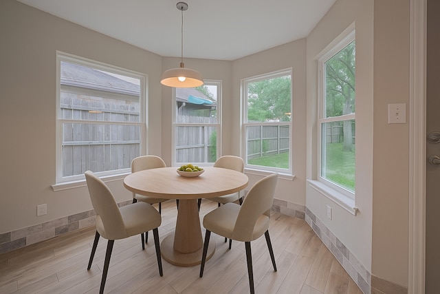 8547 Sparkling Springs Dr, Houston, TX 77095 - dining room with healthy amount of natural light, light wood-style floors, and baseboards