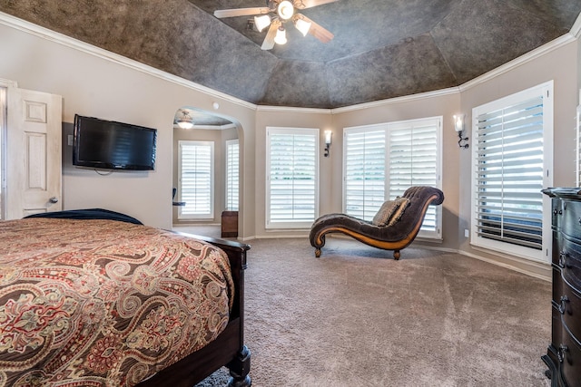 carpeted bedroom with multiple windows, baseboards, and ornamental molding