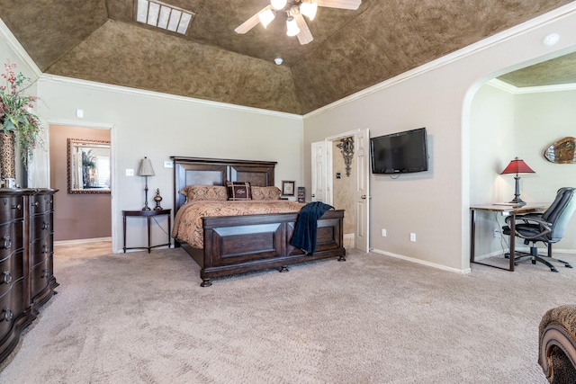 carpeted bedroom featuring baseboards, arched walkways, crown molding, and ceiling fan