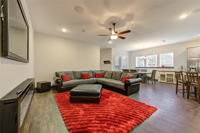 28723 Eden Creek Trl, Fulshear, TX 77441 - living room featuring ceiling fan, wood finished floors, recessed lighting, and a chandelier