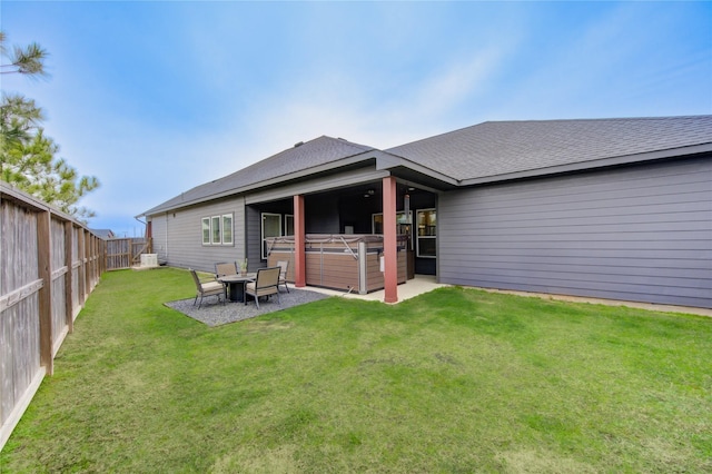 28723 Eden Creek Trl, Fulshear, TX 77441 - rear view of property featuring roof with shingles, a patio, and a hot tub