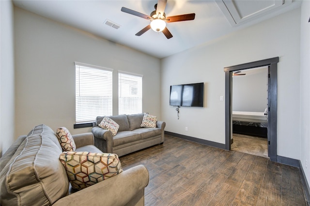 28723 Eden Creek Trl, Fulshear, TX 77441 - living room with dark wood-type flooring, a ceiling fan, baseboards, and attic access