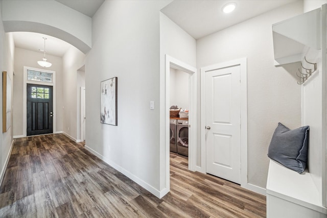 16707 Ramsay Cascades Dr, Humble, TX 77346 - entryway featuring separate washer and dryer, arched walkways, wood finished floors, baseboards, and recessed lighting