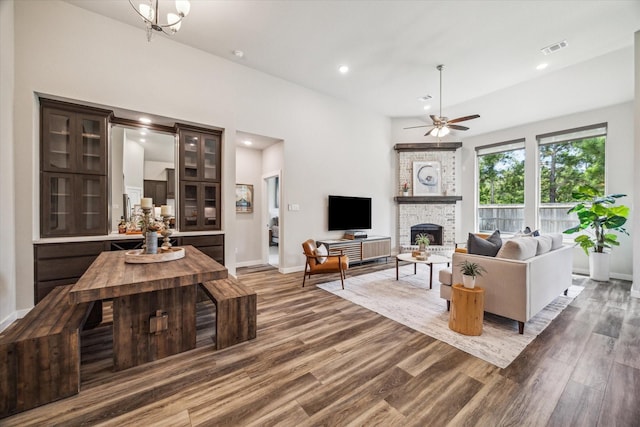 16707 Ramsay Cascades Dr, Humble, TX 77346 - living room featuring ceiling fan, wood finished floors, a fireplace, baseboards, and recessed lighting