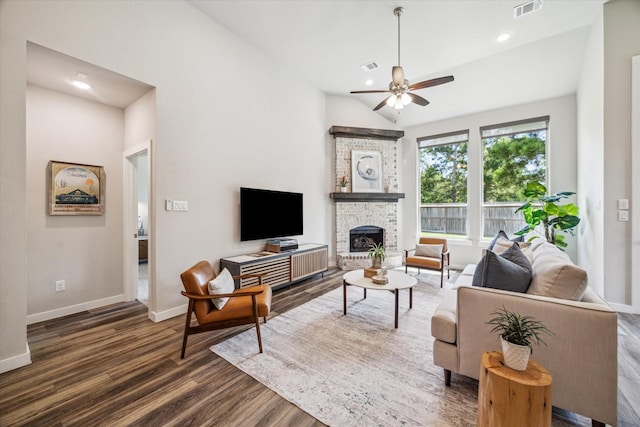 16707 Ramsay Cascades Dr, Humble, TX 77346 - living area featuring a ceiling fan, dark wood finished floors, a fireplace, baseboards, and lofted ceiling