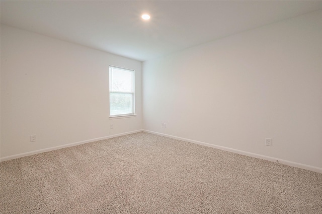 unfurnished room with light carpet, baseboards, and recessed lighting