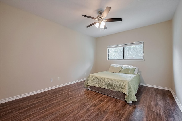 14844 Pollux Dr, Willis, TX 77318 - bedroom with dark wood finished floors, baseboards, and ceiling fan