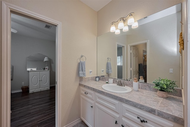 14844 Pollux Dr, Willis, TX 77318 - bathroom featuring vanity and wood finished floors