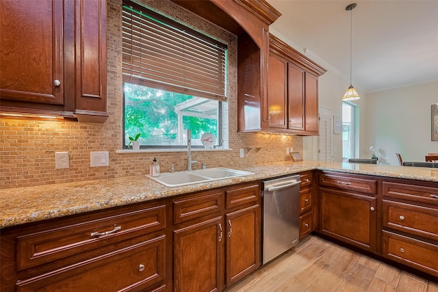 14844 Pollux Dr, Willis, TX 77318 - kitchen featuring dishwasher, a sink, light wood-type flooring, decorative backsplash, and hanging light fixtures