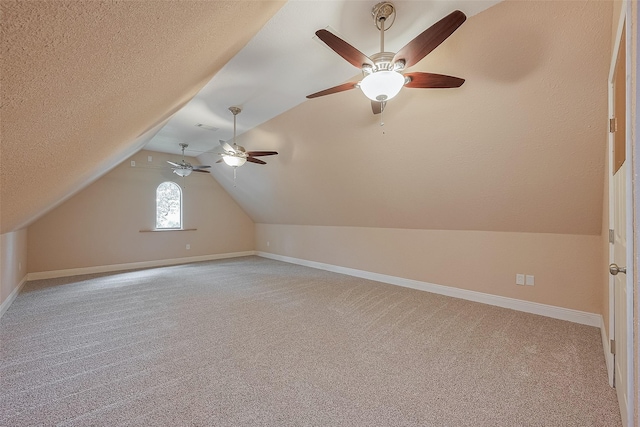 14844 Pollux Dr, Willis, TX 77318 - bonus room featuring carpet, a ceiling fan, lofted ceiling, and baseboards