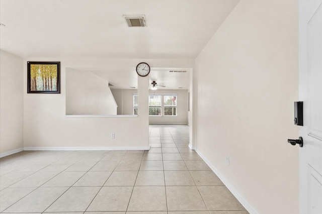 15427 Western Skies Dr, Houston, TX 77086 - unfurnished room featuring a ceiling fan, light tile patterned floors, and baseboards