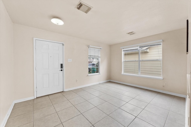 15427 Western Skies Dr, Houston, TX 77086 - entryway featuring baseboards and light tile patterned flooring