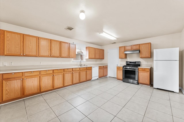 15427 Western Skies Dr, Houston, TX 77086 - kitchen featuring white appliances, light countertops, under cabinet range hood, and a sink