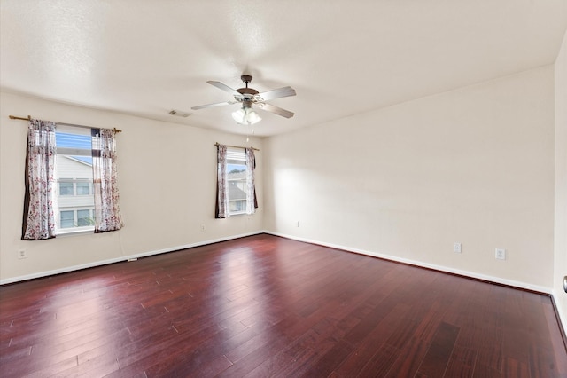 15427 Western Skies Dr, Houston, TX 77086 - empty room with a ceiling fan, dark wood-type flooring, and baseboards