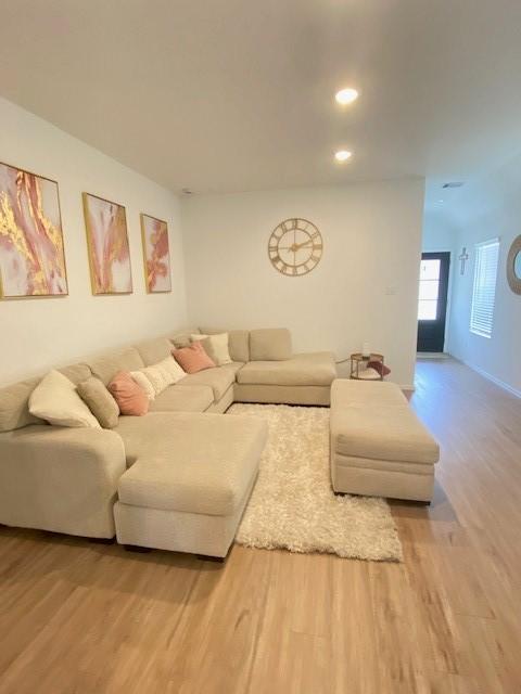 1926 Barrett Gables Dr, Crosby, TX 77532 - living room featuring wood finished floors and recessed lighting