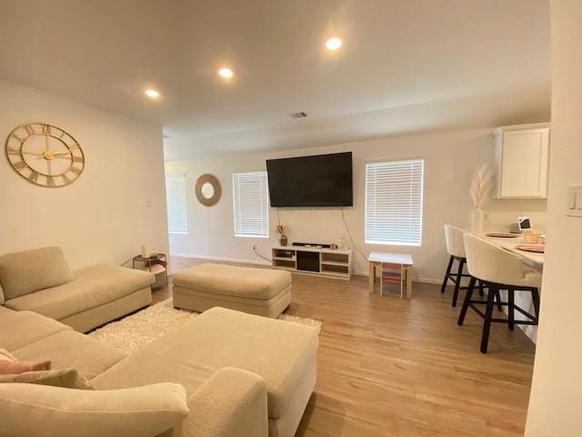 1926 Barrett Gables Dr, Crosby, TX 77532 - living room with light wood-type flooring, recessed lighting, and baseboards