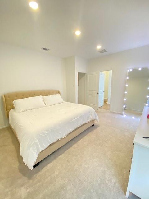 1926 Barrett Gables Dr, Crosby, TX 77532 - bedroom with light carpet, baseboards, and recessed lighting