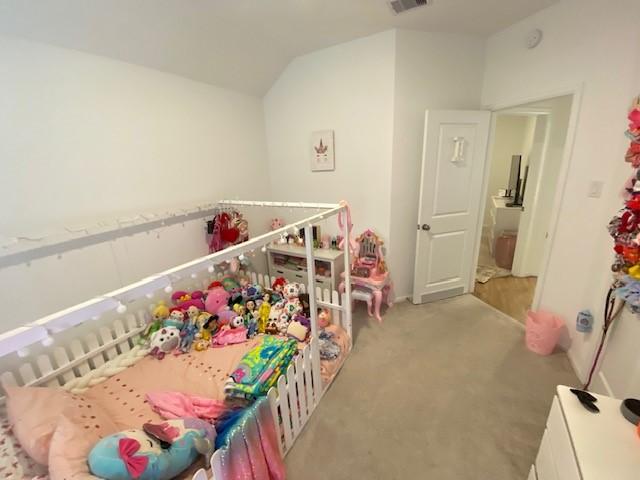 1926 Barrett Gables Dr, Crosby, TX 77532 - carpeted bedroom with vaulted ceiling