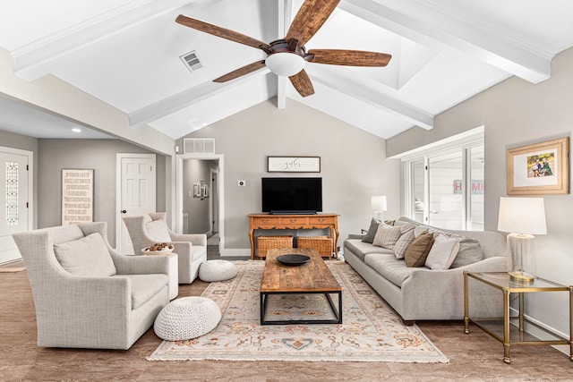 living area featuring wood finished floors, ceiling fan, and baseboards
