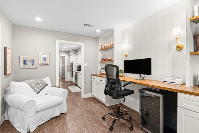 office area with wood finished floors, recessed lighting, and baseboards