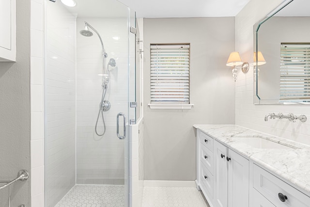bathroom featuring a stall shower and vanity