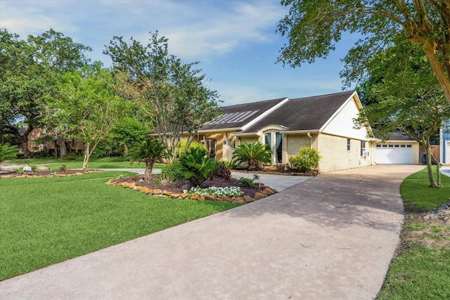 4114 Plumtree Ln, Seabrook, TX 77586 - view of front of property with driveway, a front lawn, a garage, an outdoor structure, and brick siding