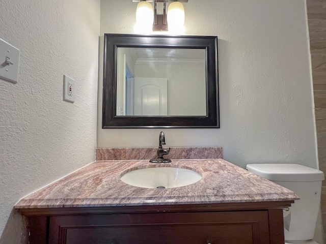 11106 Sagevalley Dr N, Houston, TX 77089 - bathroom featuring vanity, toilet, and a textured wall