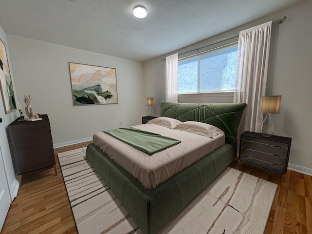 11106 Sagevalley Dr N, Houston, TX 77089 - bedroom featuring wood finished floors and baseboards
