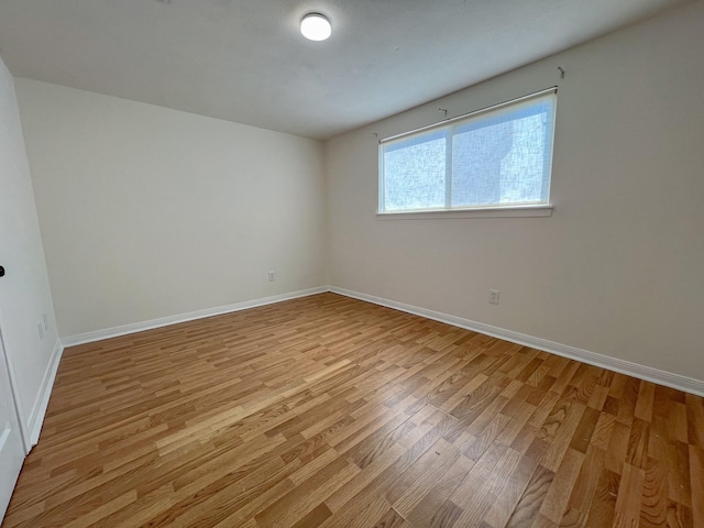 11106 Sagevalley Dr N, Houston, TX 77089 - empty room featuring light wood-style floors and baseboards