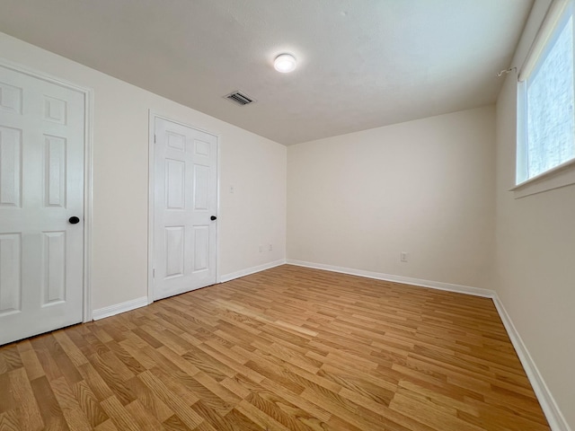 11106 Sagevalley Dr N, Houston, TX 77089 - unfurnished bedroom featuring light wood-style flooring and baseboards