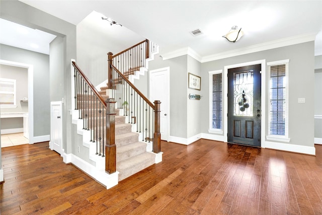 30622 Indigo Falls Dr, Fulshear, TX 77423 - entrance foyer featuring hardwood / wood-style floors, stairway, and crown molding
