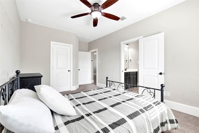 30622 Indigo Falls Dr, Brookshire, TX 77423 - carpeted bedroom with baseboards, connected bathroom, and a ceiling fan