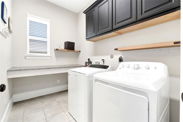 30622 Indigo Falls Dr, Brookshire, TX 77423 - washroom with cabinet space, independent washer and dryer, baseboards, and light tile patterned floors