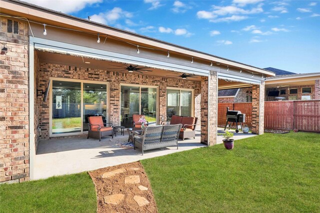 30622 Indigo Falls Dr, Brookshire, TX 77423 - rear view of house with ceiling fan, brick siding, an outdoor hangout area, and a patio