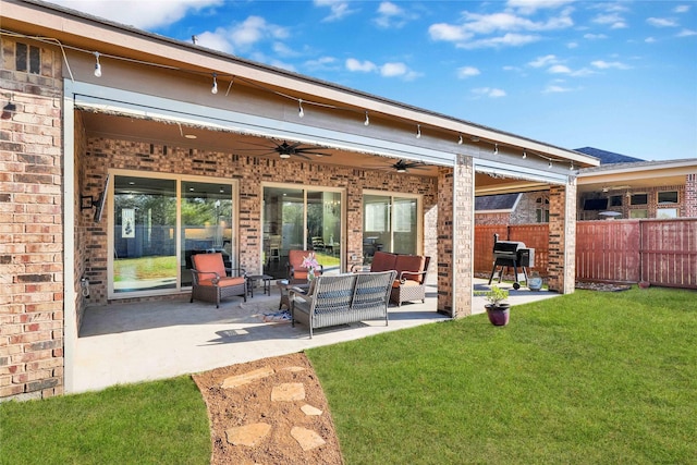 30622 Indigo Falls Dr, Fulshear, TX 77423 - rear view of property featuring a ceiling fan, brick siding, an outdoor living space, and a patio
