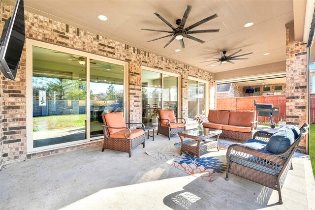 30622 Indigo Falls Dr, Fulshear, TX 77423 - view of patio featuring a ceiling fan and outdoor lounge area