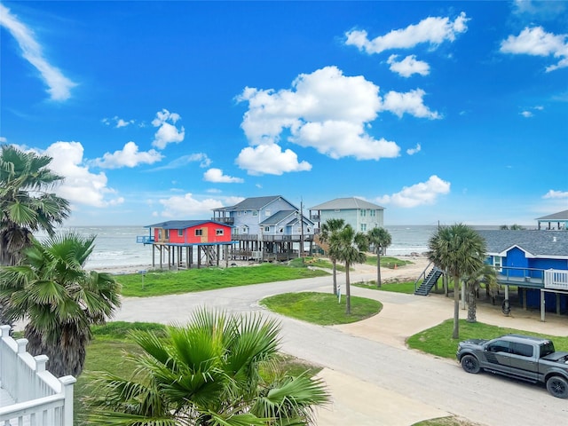 206 San Luis Blvd, Freeport, TX 77541 - view of home's community with a water view and fence