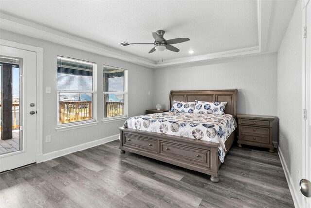 206 San Luis Blvd, Freeport, TX 77541 - bedroom featuring dark wood finished floors, a raised ceiling, ceiling fan, and baseboards